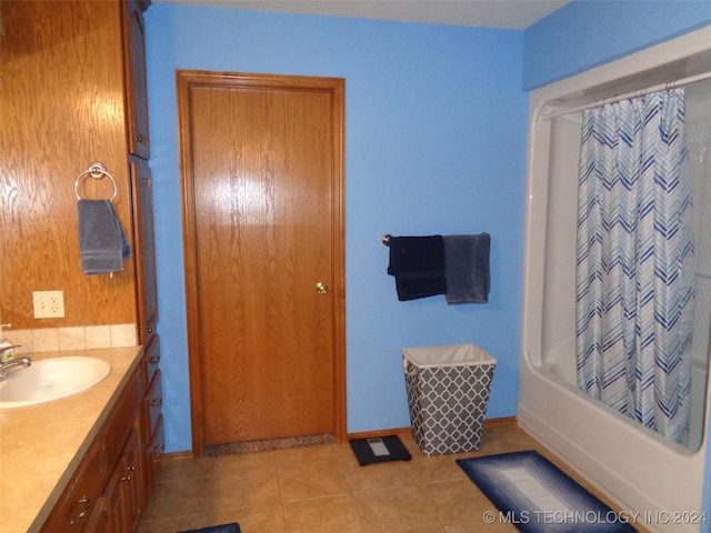 bathroom featuring vanity, tile patterned flooring, and shower / bathtub combination with curtain