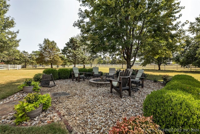 view of yard with a fire pit