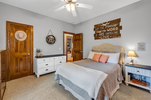 carpeted bedroom featuring ceiling fan