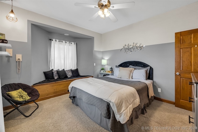 bedroom featuring light colored carpet and ceiling fan