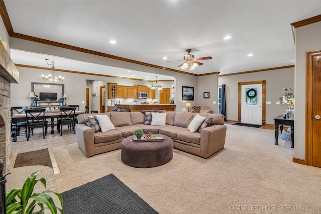 living room with ceiling fan with notable chandelier, light colored carpet, and ornamental molding