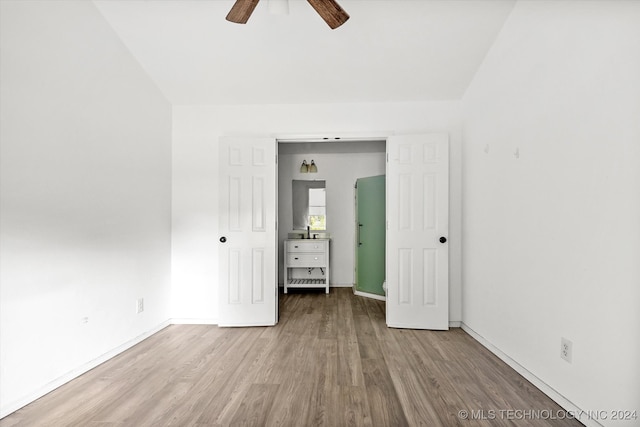 empty room featuring ceiling fan and hardwood / wood-style flooring