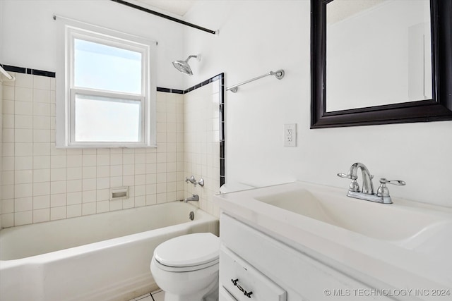 full bathroom with vanity, toilet, and tiled shower / bath combo