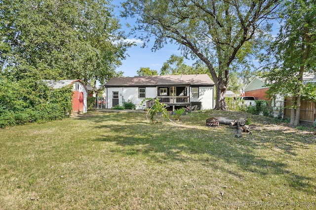 exterior space with a fire pit, a lawn, and a shed