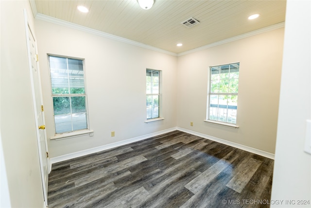 spare room featuring crown molding and dark hardwood / wood-style floors