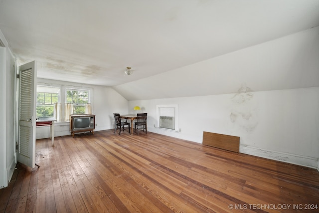 bonus room featuring lofted ceiling and hardwood / wood-style floors