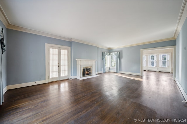 unfurnished living room featuring crown molding, dark hardwood / wood-style floors, and plenty of natural light