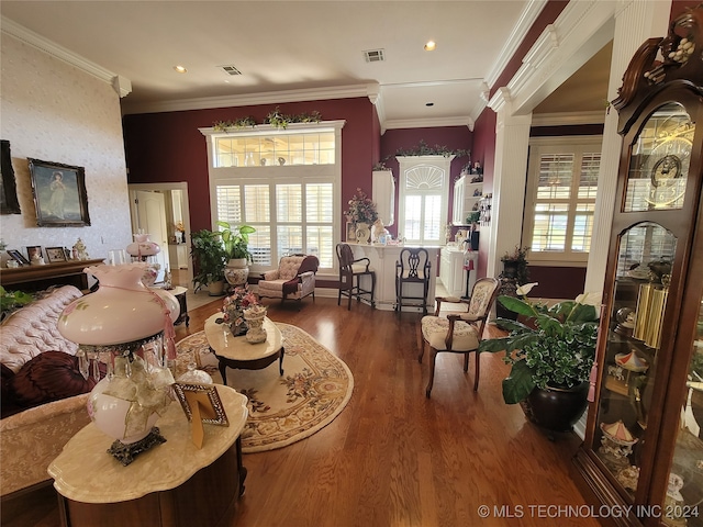 living room featuring crown molding and hardwood / wood-style flooring