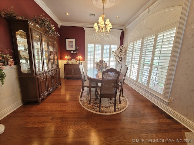 dining space featuring crown molding, a notable chandelier, and dark hardwood / wood-style flooring