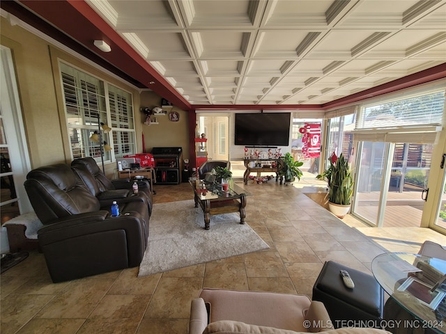 living room featuring ornamental molding and coffered ceiling