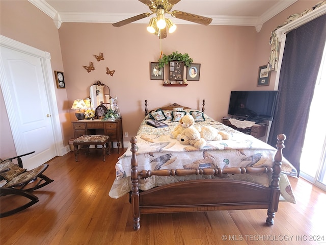 bedroom with crown molding, ceiling fan, and hardwood / wood-style floors