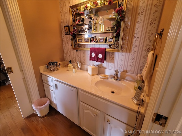 bathroom with vanity and hardwood / wood-style flooring