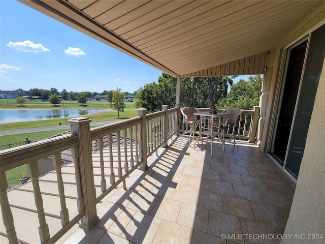 balcony featuring a water view