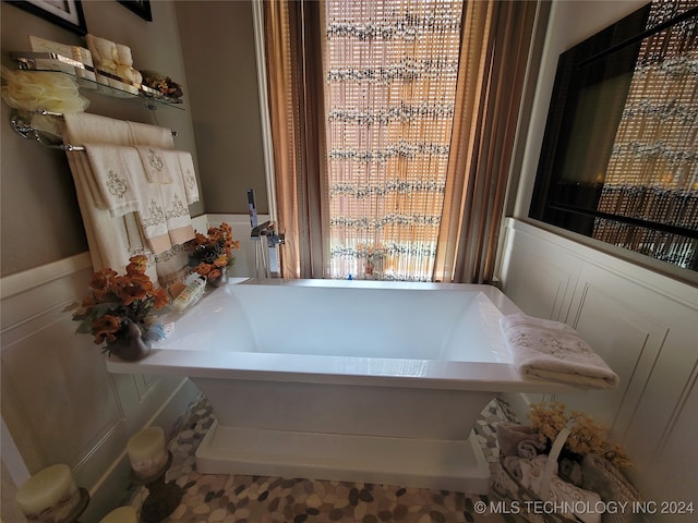 bathroom featuring a tub