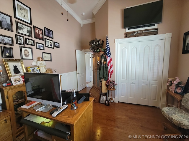 office area featuring crown molding and dark hardwood / wood-style floors