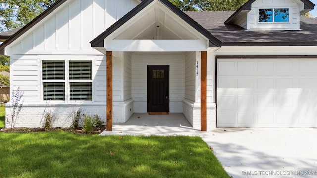 view of front of property with a garage and a front yard