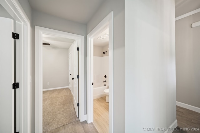 hallway with light wood-type flooring