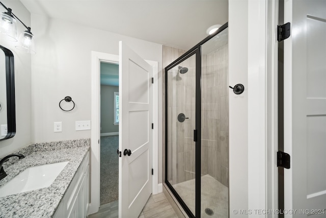 bathroom featuring vanity and walk in shower