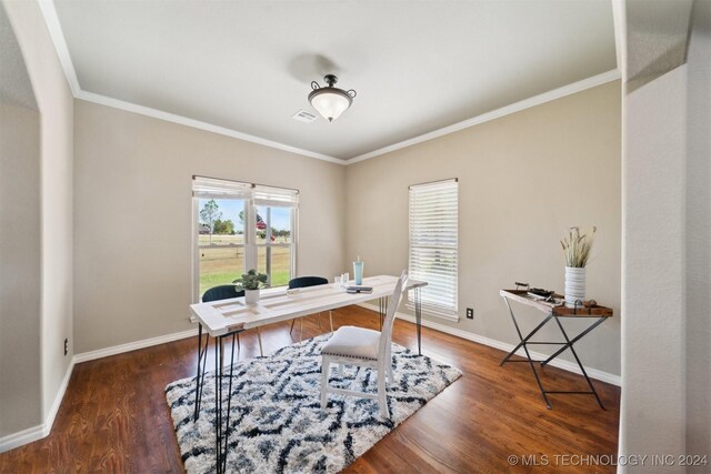 office with crown molding and dark wood-type flooring