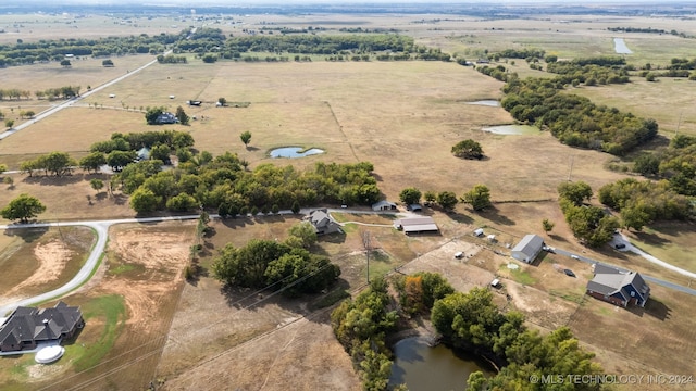 birds eye view of property with a rural view