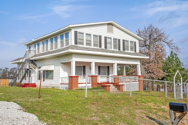 view of front of home with a porch and a front lawn