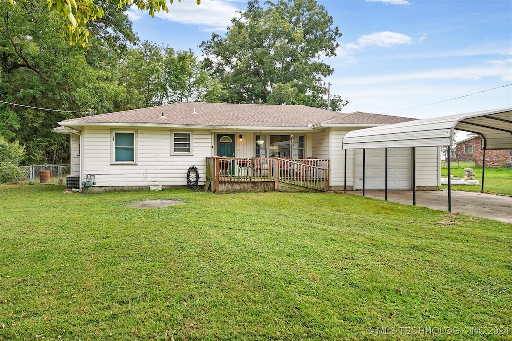 ranch-style house with central AC unit, a front lawn, and a carport