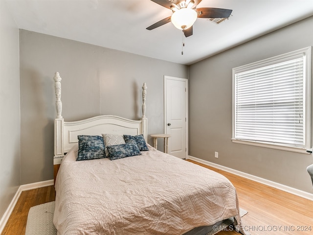 bedroom featuring light hardwood / wood-style flooring and ceiling fan