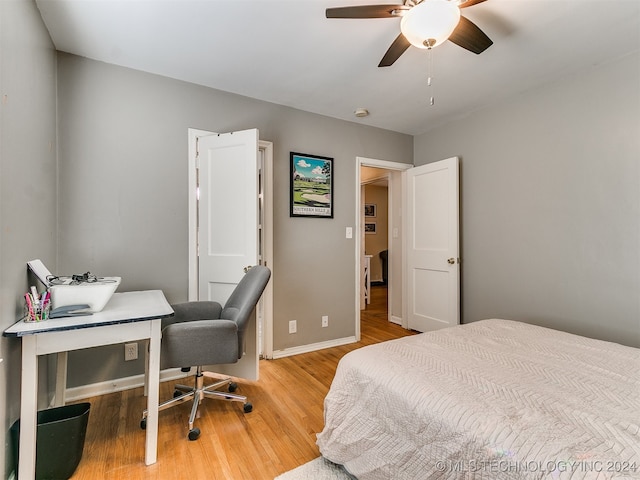 bedroom featuring hardwood / wood-style floors and ceiling fan