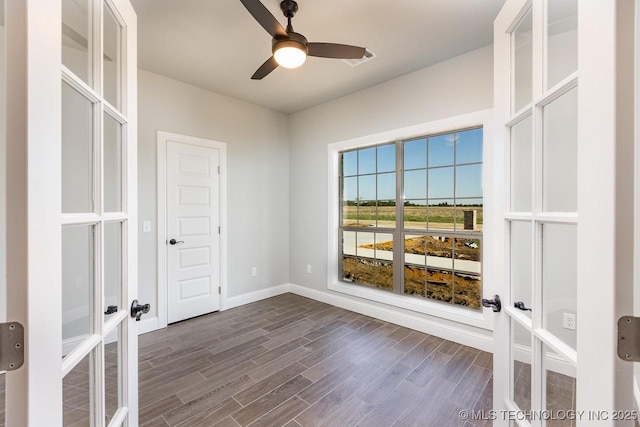 spare room featuring french doors and ceiling fan