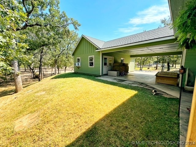 view of yard featuring a carport