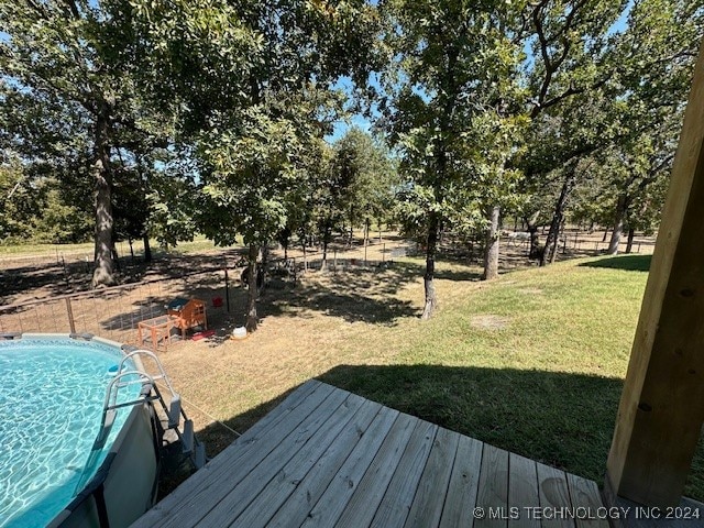 view of yard featuring a swimming pool side deck