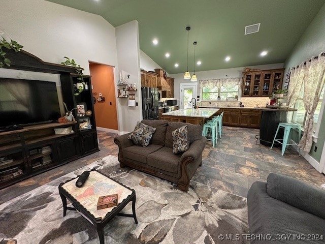 living room featuring vaulted ceiling