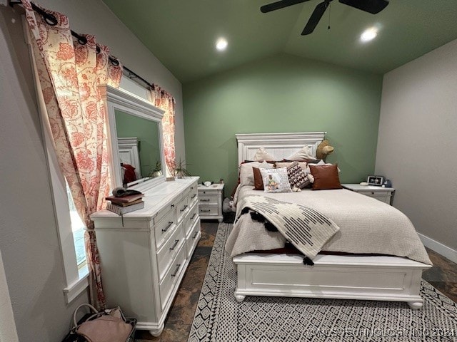 bedroom featuring vaulted ceiling, dark hardwood / wood-style flooring, and ceiling fan