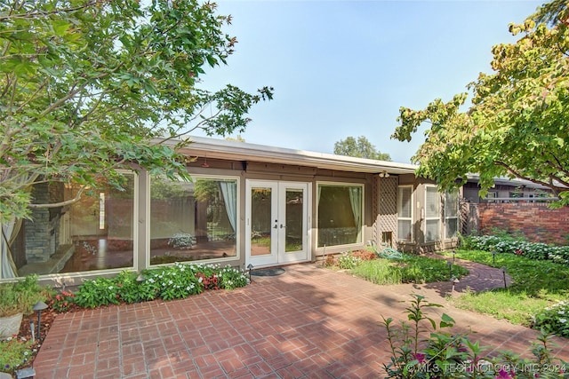 2116 E 59th Pl Unit 4F, Tulsa, OK 74105 - view of patio featuring french doors