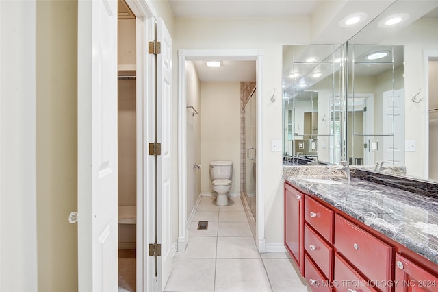 2116 E 59th Pl Unit 4F, Tulsa, OK 74105 - bathroom with tile patterned flooring, vanity, a shower stall, and recessed lighting