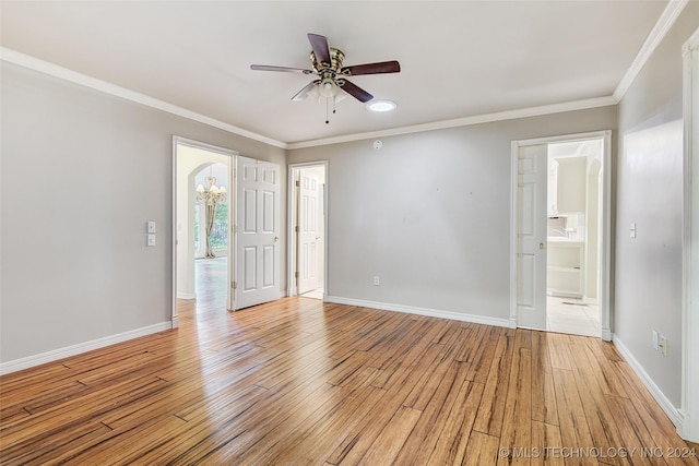 2116 E 59th Pl Unit 4F, Tulsa, OK 74105 - spare room featuring light wood-type flooring, ceiling fan, and crown molding