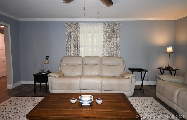 living room featuring ornamental molding, ceiling fan, and dark hardwood / wood-style floors