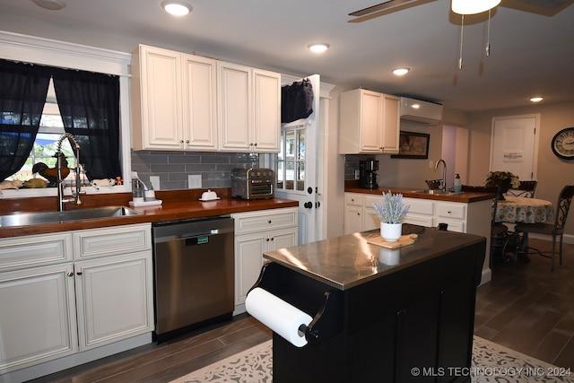 kitchen with dishwasher, sink, ceiling fan, dark wood-type flooring, and white cabinets