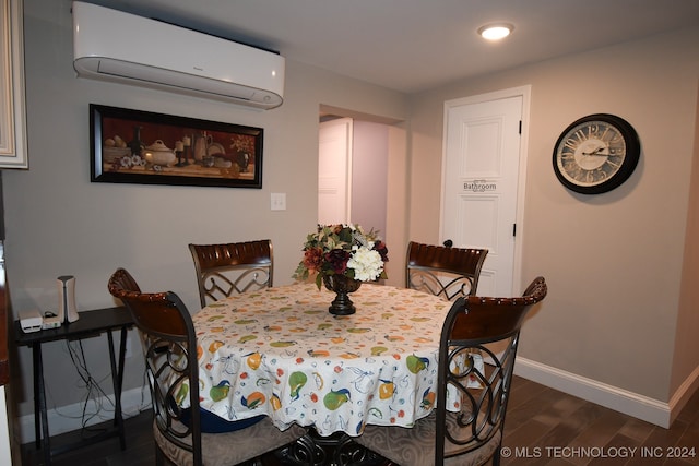 dining area featuring dark wood-type flooring and an AC wall unit