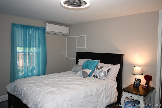 bedroom with a wall mounted AC