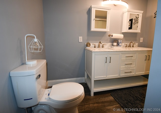 bathroom featuring hardwood / wood-style floors, toilet, and vanity