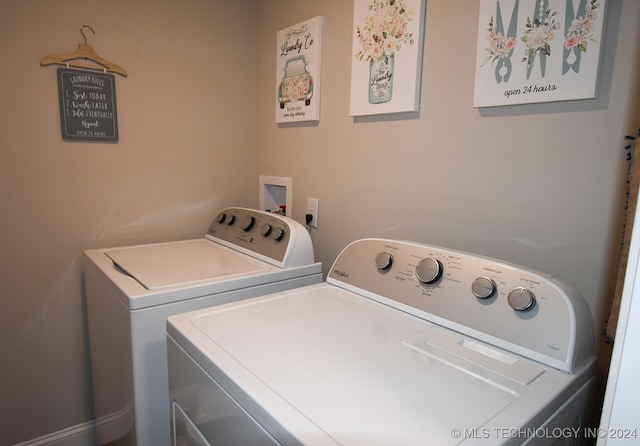 laundry area with separate washer and dryer