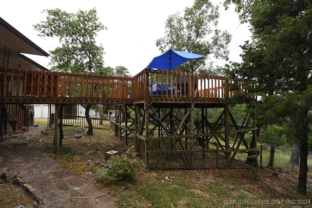 view of playground with a deck