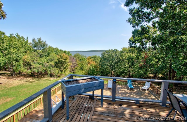 deck featuring a water view