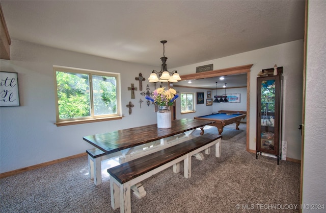 carpeted dining space featuring a notable chandelier and pool table