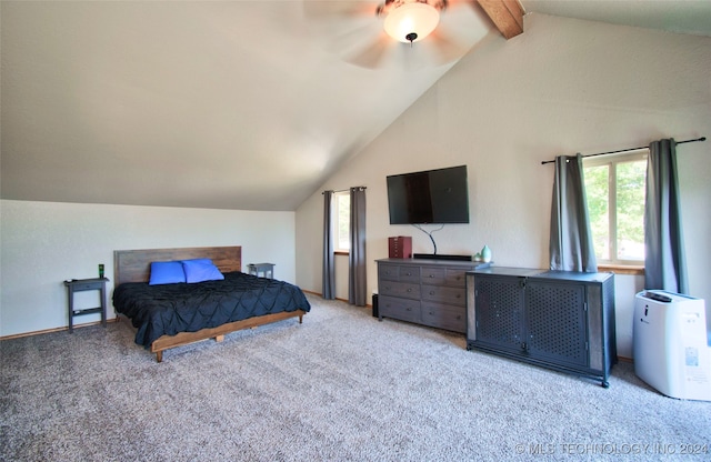 carpeted bedroom with lofted ceiling with beams and ceiling fan