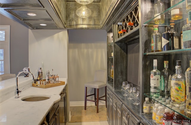 bathroom featuring wood-type flooring and sink