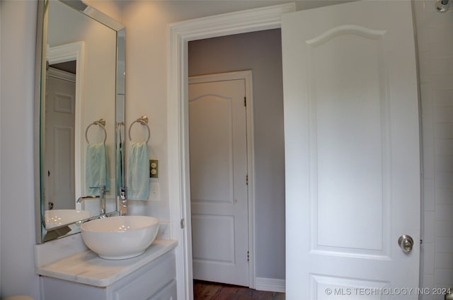 bathroom featuring vanity and hardwood / wood-style flooring