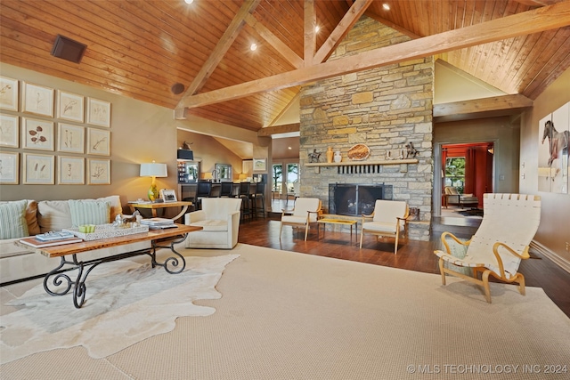 living room with hardwood / wood-style floors, high vaulted ceiling, wood ceiling, and a fireplace