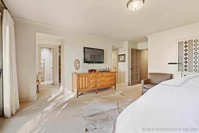 carpeted bedroom featuring ornamental molding